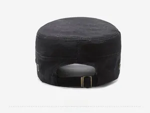 Detail of adjustable metal buckle and ventilation eyelets on black cotton cadet cap