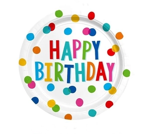 Close-up of disposable birthday paper plate with colorful polka dots and happy birthday text