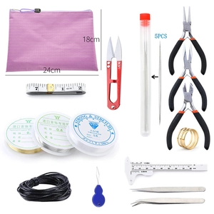 DIY jewelry making kit featuring tools, copper wire and pink storage bag shown in detail