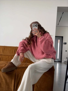 Detail of pink fleece sweatshirt showing thick texture and stylish half-zip stand collar