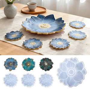 Macro detail of lotus shaped silicone molds and finished blue gold resin coasters