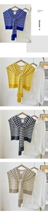Detail of striped knitted shawl collars in four colors on a white shirt display