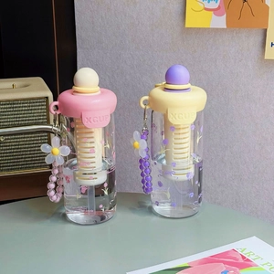 Detailed view of floral water cups with straws, carry straps and built-in tea filters