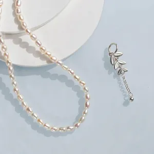 Natural freshwater pearl necklace with S925 silver leaf pendant on a blue background