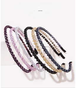 Detail view of crystal beaded headbands in multiple colors like purple pink and champagne