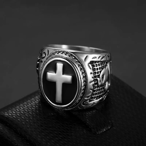 Silver vintage hip hop signet ring with white cross emblem on black leather display