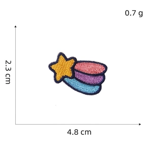 Detailed embroidery patch of a shooting star measuring 4.8 cm by 2.3 cm weighing 0.7 grams