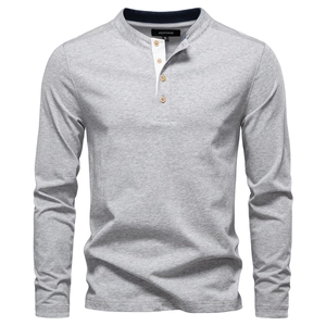 Detailed view of Henley collar with wooden buttons and white placket on grey shirt