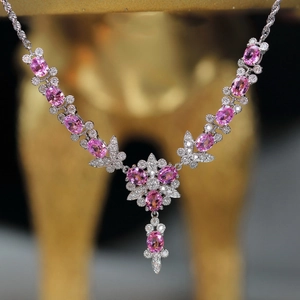 Luxury butterfly floral necklace featuring pink sapphires and shimmering white diamonds