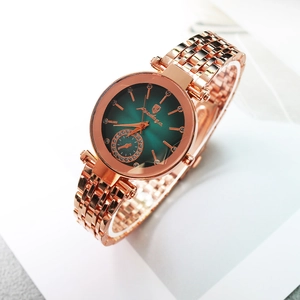 Montre Poedagar en or rose avec cadran vert émeraude soleil et index en strass