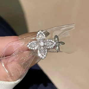 Detailed shot of a silver floral zircon ring with marquise and round cut stones