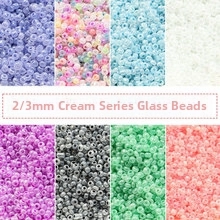 Detail of 2mm and 3mm cream series glass seed beads for DIY jewelry making