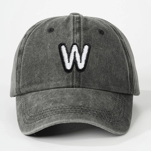 Close-up of vintage washed cotton grey baseball cap with embroidered W letter detail