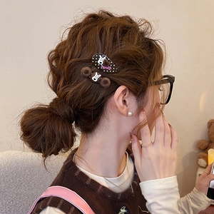 Detailed view of Snoopy Peanuts hair clip set with brown velvet balls and polka dots