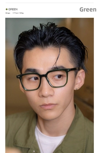Close-up of stylish dark green oversized glasses worn by a model in natural lighting