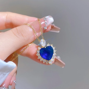 Titanium steel heart necklace with large blue gemstone and dazzling zircon border