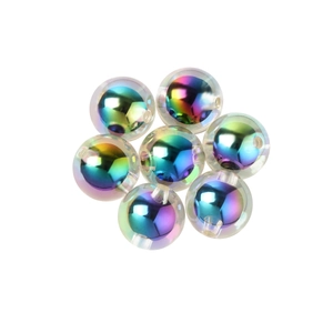 Seven round acrylic rainbow AB beads for DIY jewelry making on white background