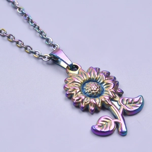 Macro shot of iridescent rainbow sunflower pendant necklace on light purple background