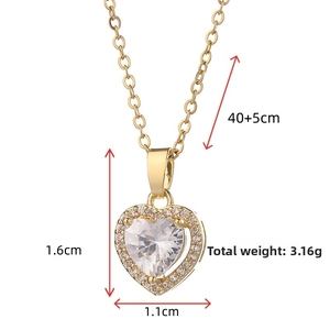 Detail of gold heart pendant with crystal center and pave setting, 40+5cm length