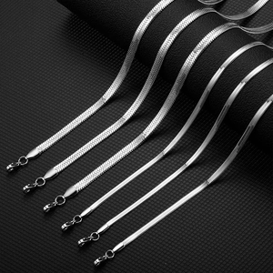 Detail view of silver stainless steel flat snake chain necklaces with lobster clasps