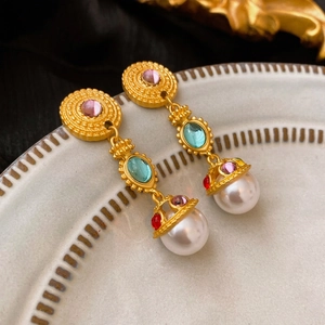 Vintage palace style drop earrings with blue stones and pearls on elegant gold metal