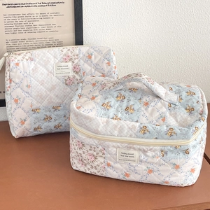 Quilted floral makeup bag set with large handle pouch and flat pouch in blue and pink