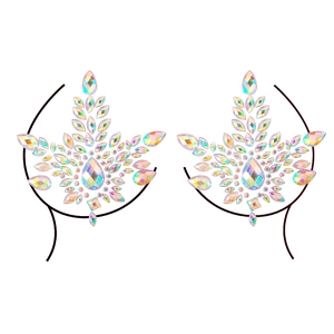 Macro shot of iridescent AB crystal heart-shaped body jewels and decorative chest stickers