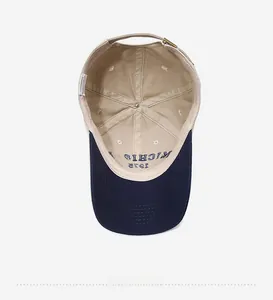 Detail view of cotton baseball cap interior showing 100% cotton label and Michigan stitching