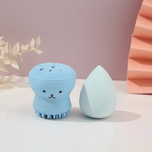 Detail view of the soft light blue octopus silicone brush and cosmetic sponge blender set