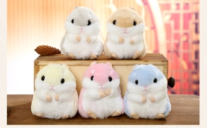 Detailed view of five colorful plush hamster keychains in a cozy, staged display