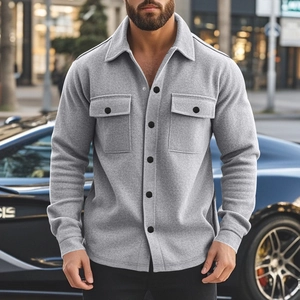 Close-up of grey slim fit men's jacket featuring flannel texture and utility chest pockets