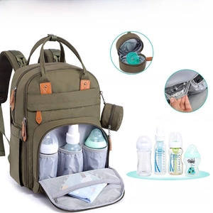 Detail of insulated aluminum foil bottle pockets and detachable pacifier bag on mummy bag