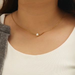 Minimalist gold stainless steel necklace with a single white pearl pendant for women