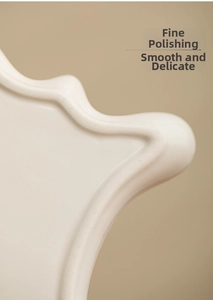 Close-up of wavy ceramic tray edge with polished white glossy glazed texture finish