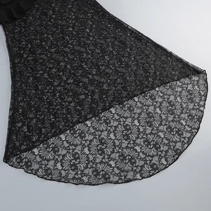 Close-up of black floral lace hem with intricate embroidery and scallop edge detail