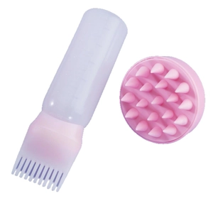 Pink silicone hair wash brush with a graduated hair dye applicator bottle set
