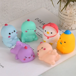 Set of six cute colorful squeeze dinosaur toys in soft pastel tones for stress relief