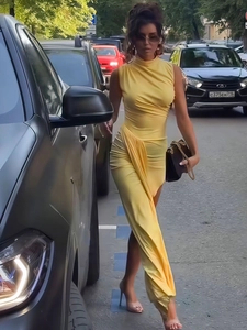 Elegant yellow sleeveless high-neck maxi dress with side ruching and a slit detail