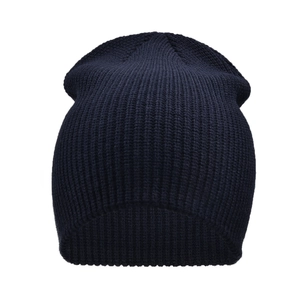 Close-up of thick ribbed knit texture on a navy blue winter beanie for outdoor warmth