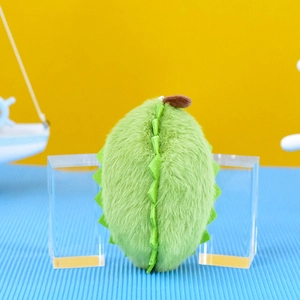 Side view detail of a cute green durian plush pendant keychain with soft fuzzy texture.
