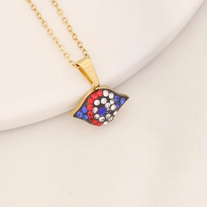 Detailed close-up of golden eye pendant necklace with red, white and blue rhinestones