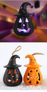 Detail of Halloween LED lanterns with wizard hats and rope handles in pumpkin and skull styles