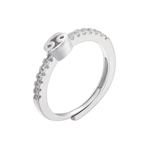 Macro shot of silver Cancer zodiac ring with sparkling cubic zirconia and open band