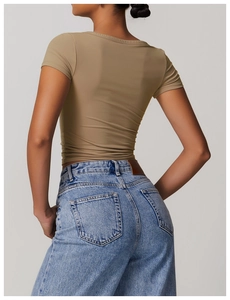 Rear view of a slim fit brown athletic short sleeve t-shirt with high-waisted blue denim jeans