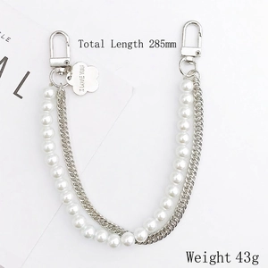 Dual-layer pearl and silver metal chain accessory with engraved flower heart charm