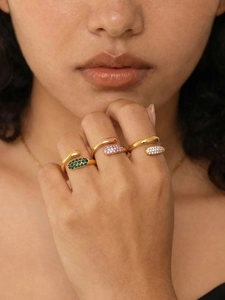 Detail of adjustable 18K gold plated rings with green, pink and white micro-pave stones