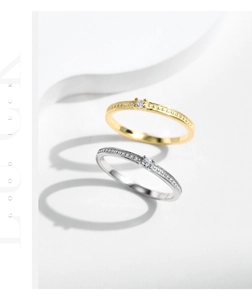 Macro detail of gold and silver beaded rings with sparkling pavé cubic zirconia accents