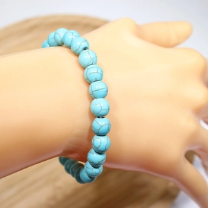 Handmade turquoise beaded bracelet with natural blue stones and brown vein patterns
