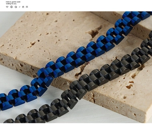 Macro detail of industrial style titanium steel bracelet in blue and matte black finishes