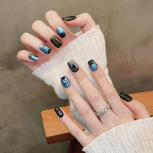 Deep blue and purple gradient cat eye press-on nails with silver glitter and cat silhouette